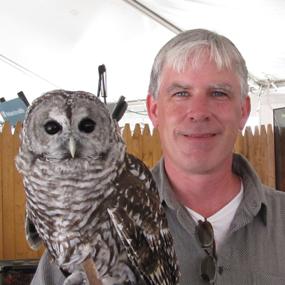 Patrick Comins holding owl