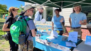 Volunteers from the Plover Project talking to members of the public.