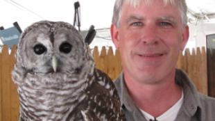 Patrick Comins holding owl