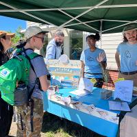 Volunteers from the Plover Project talking to members of the public.